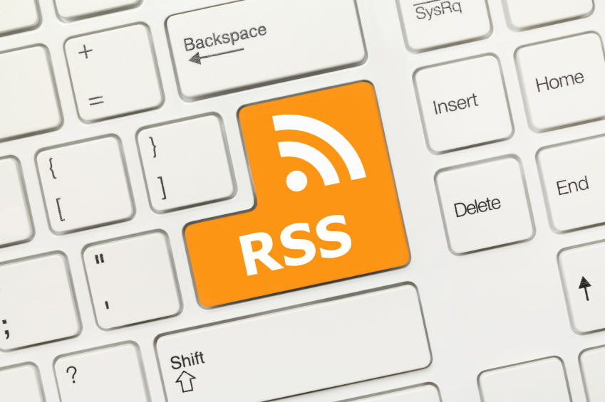 Close-up view on white conceptual keyboard - RSS (key with logotype)